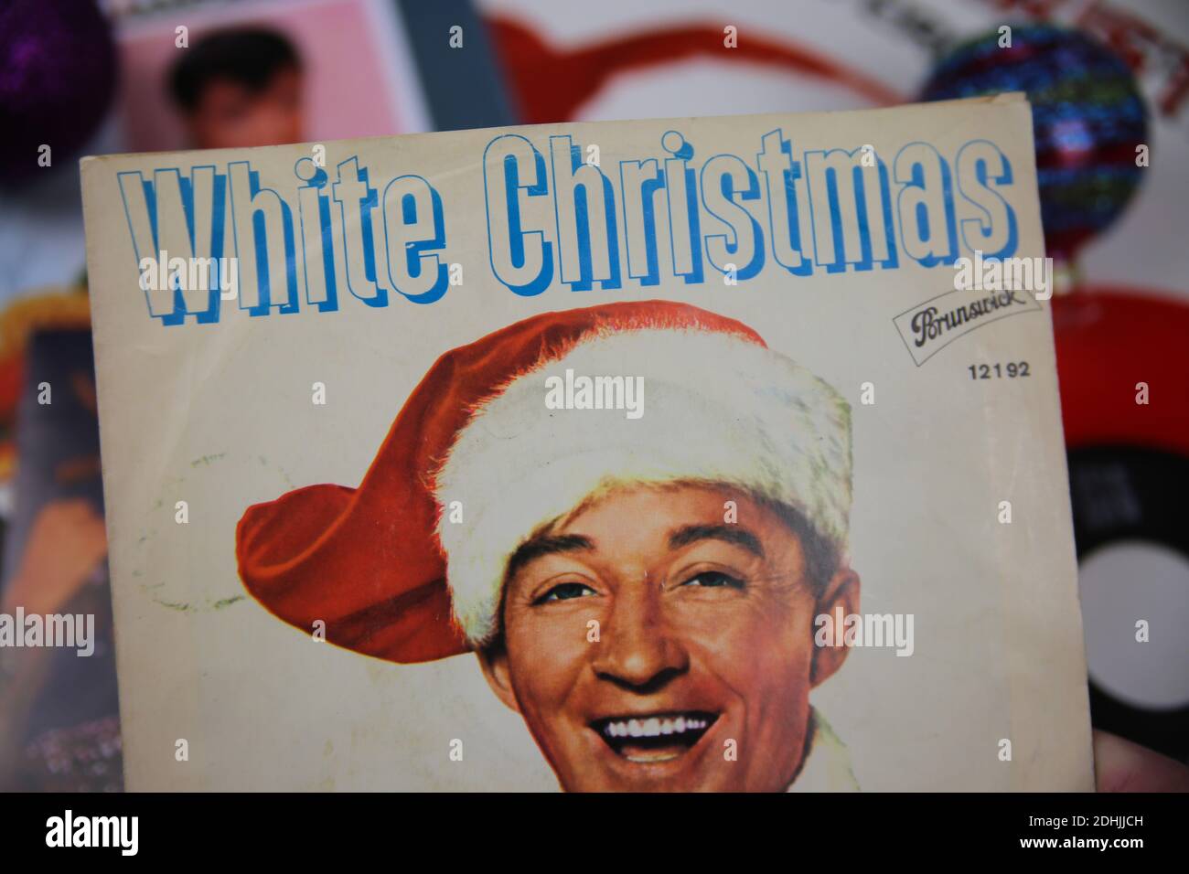 Viersen, Germany - December 9. 2020: Close up of vintage vinyl record cover singles with famous christmas songs (focus on Bing Crosby white christmas Stock Photo