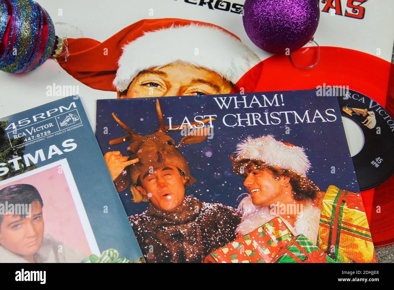 Viersen, Germany - December 9. 2020: Close up of vintage vinyl record cover singles with famous christmas songs (focus on Wham last christmas cover) Stock Photo