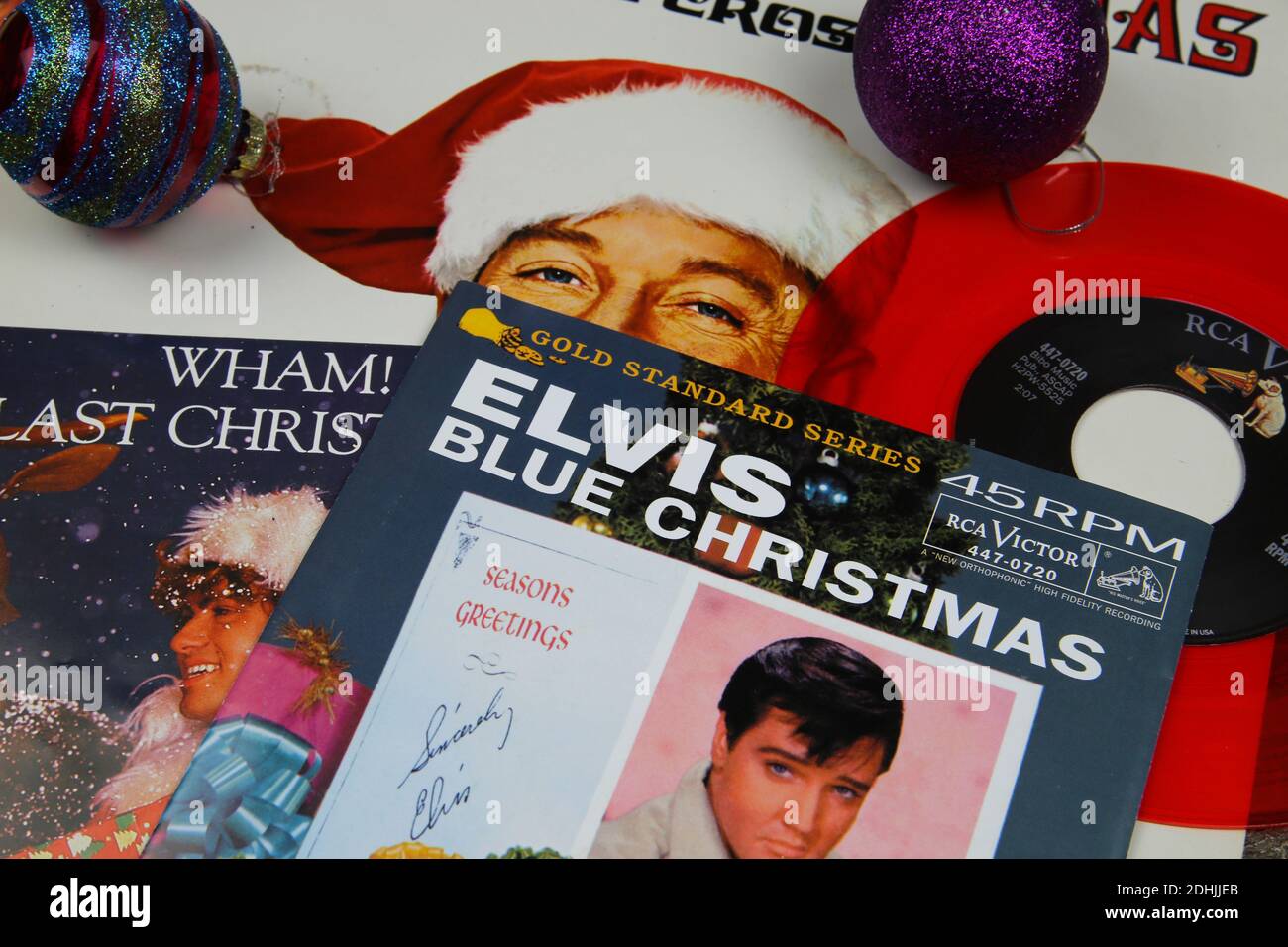 Viersen, Germany - December 9. 2020: Close up of vintage vinyl record cover singles with famous christmas songs (focus on Elvis Presley blue christmas Stock Photo