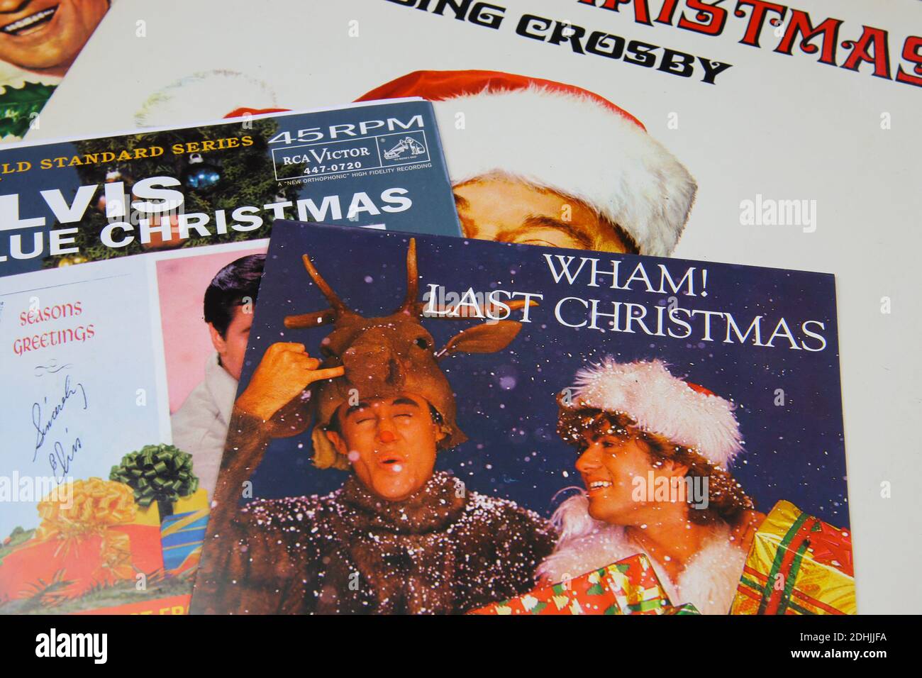 Viersen, Germany - December 9. 2020: Close up of vintage vinyl record cover singles with famous christmas songs (focus on Wham last christmas cover) Stock Photo