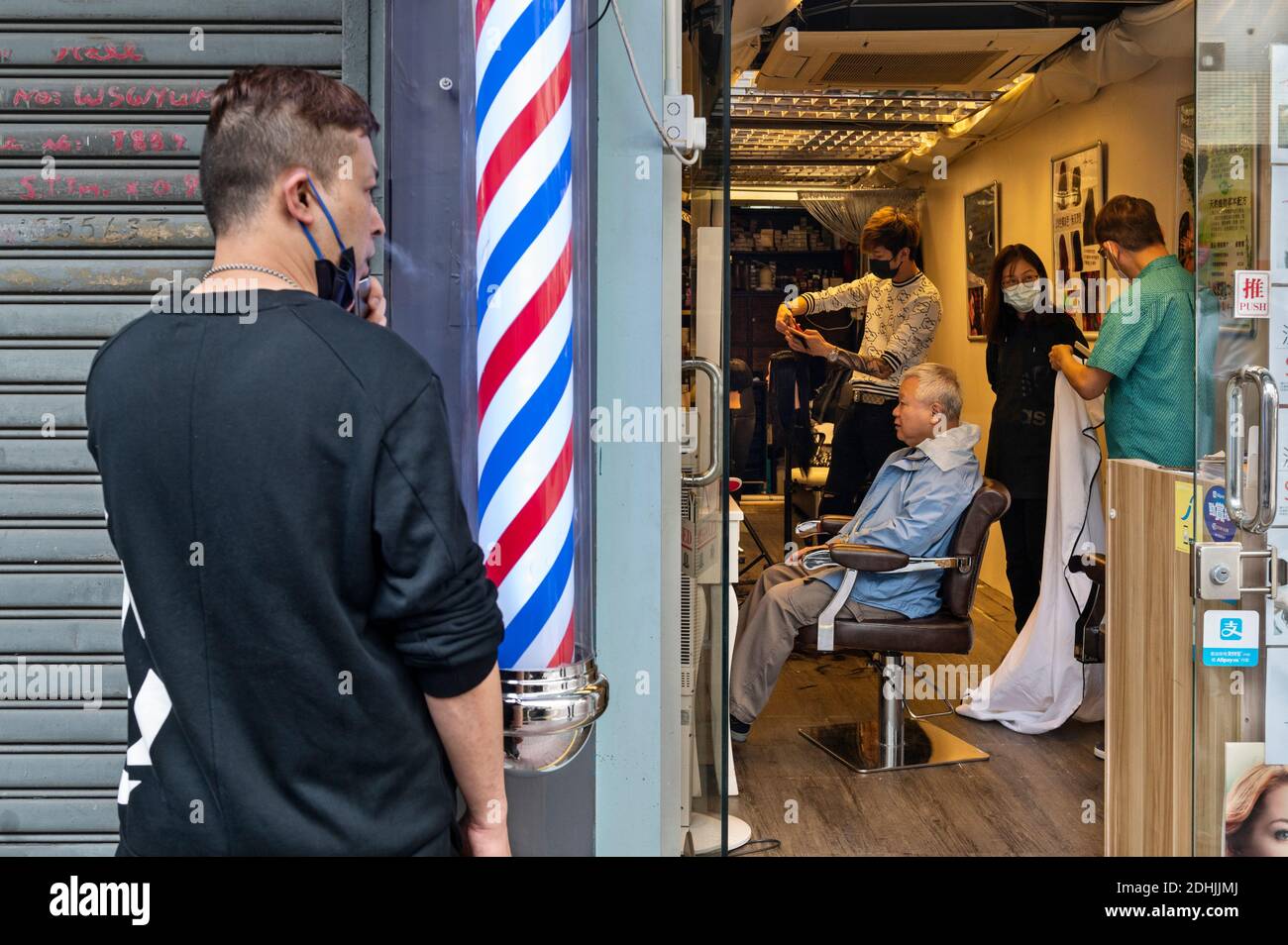 A customer is having a hair cut at a hair salon in Hong Kong.Hong ...