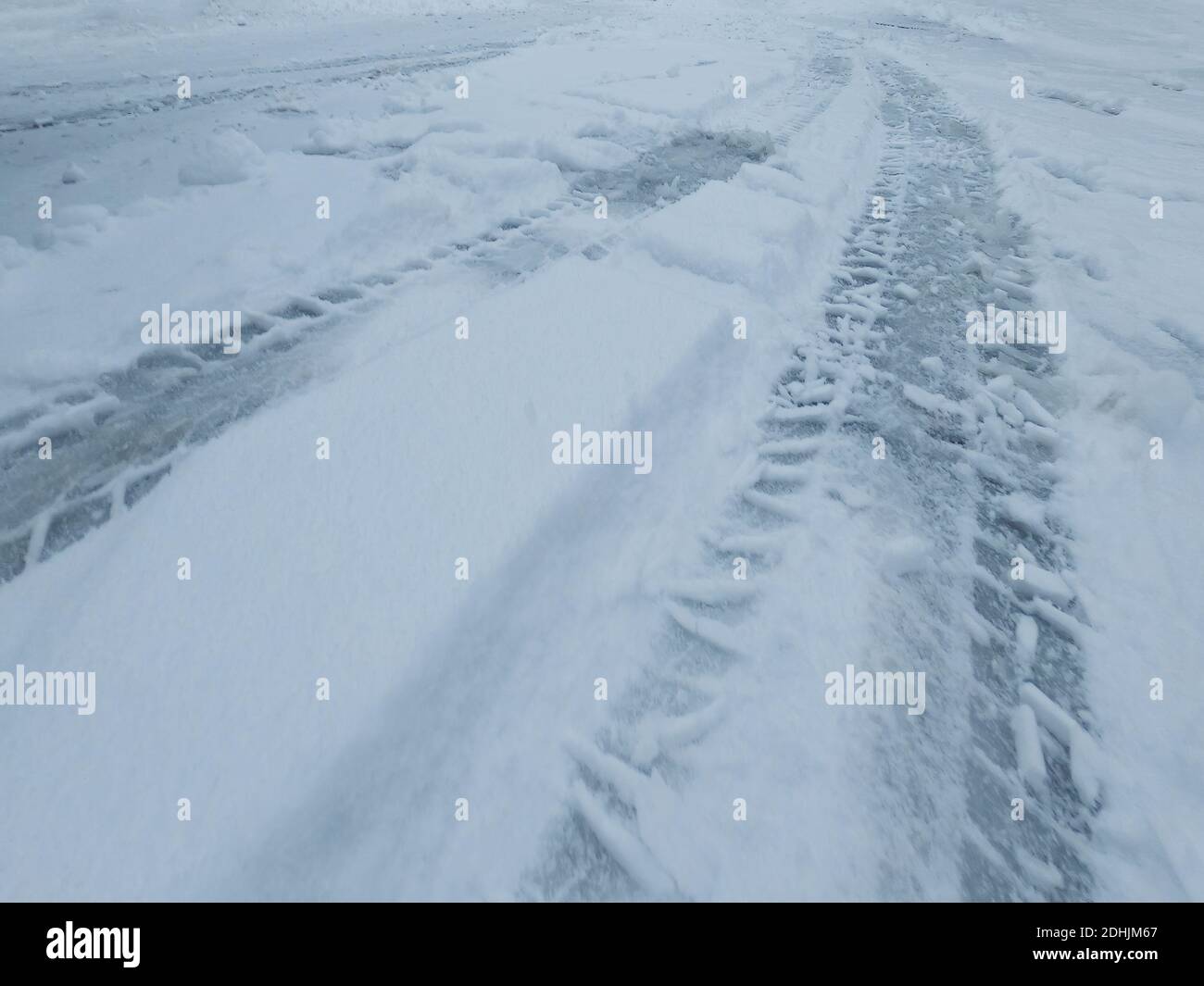Tire tracks on snowy road hi-res stock photography and images - Alamy