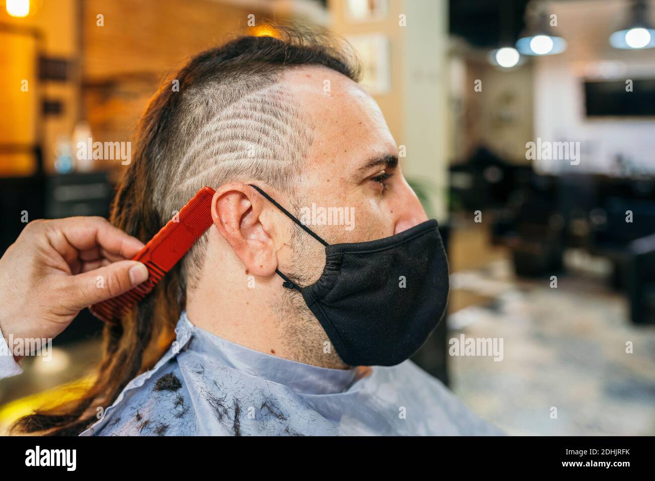Men haircut process hairstylist combing hi-res stock photography and ...