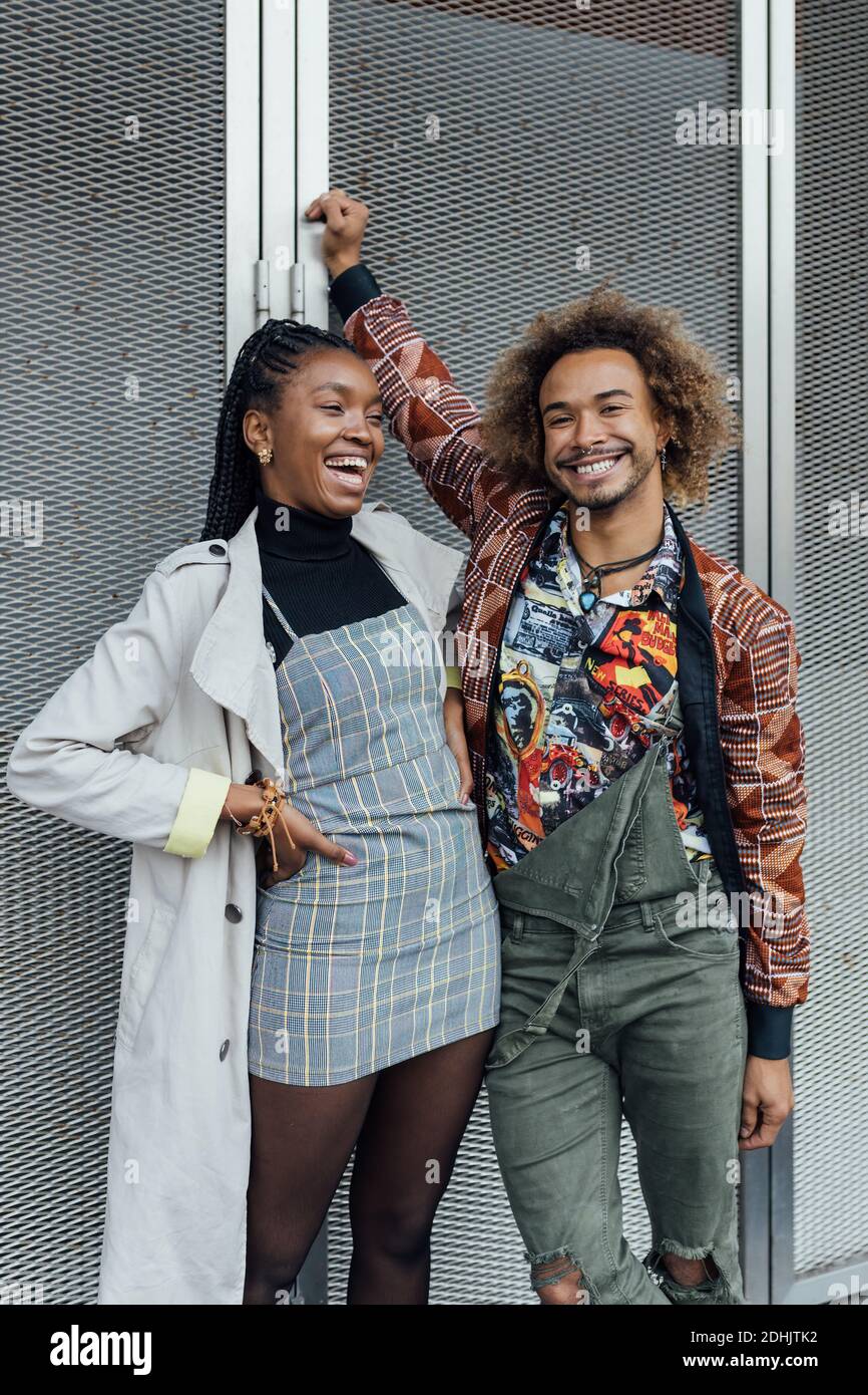 Positive young African American man and Woman in trendy casual wear ...