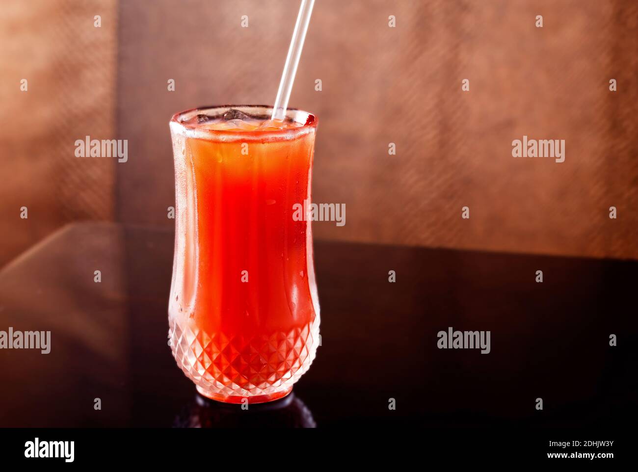 Grenadine and orange juice in a glass with copy space Stock Photo