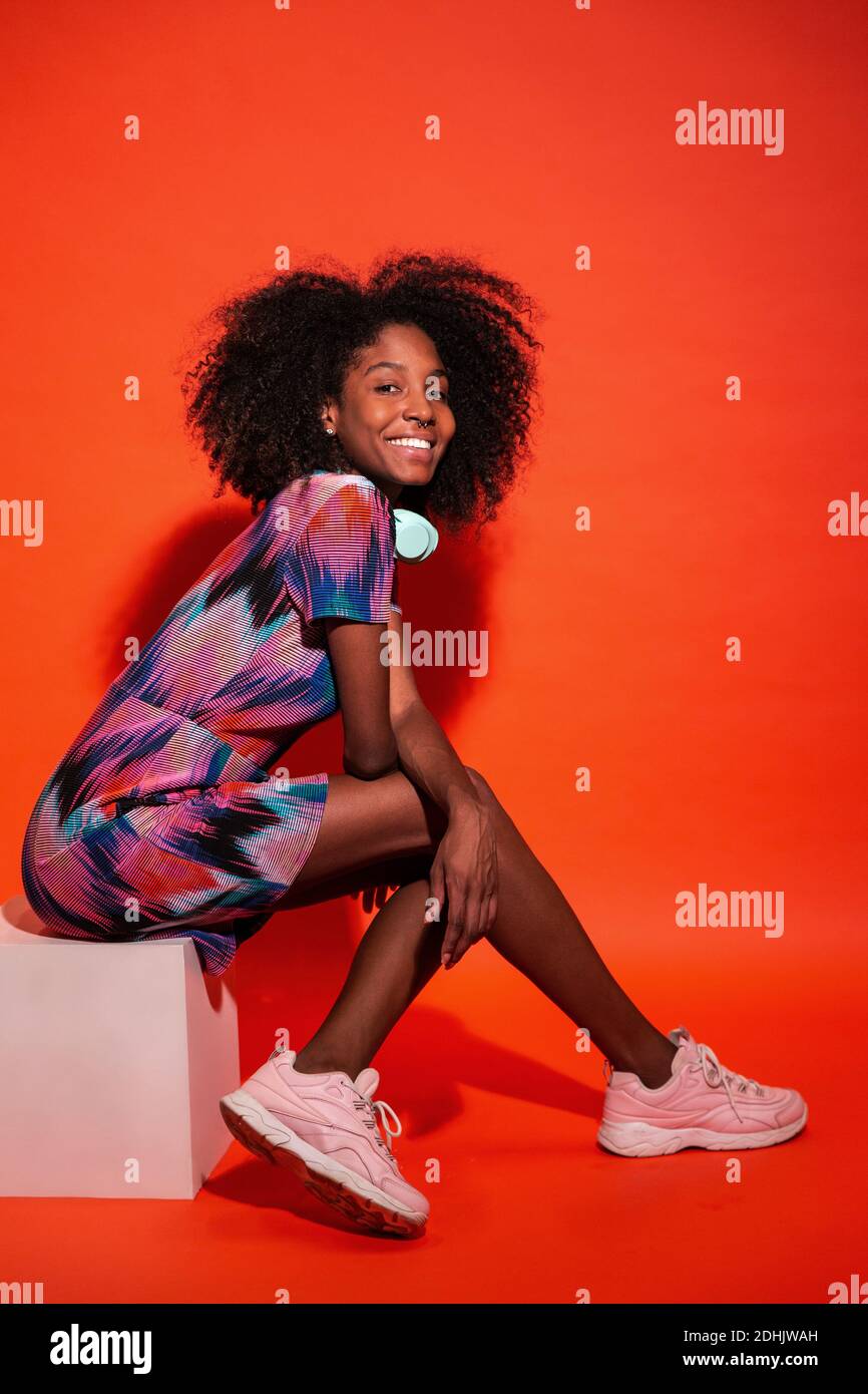 Afro hairstyle wearing vivid dress 