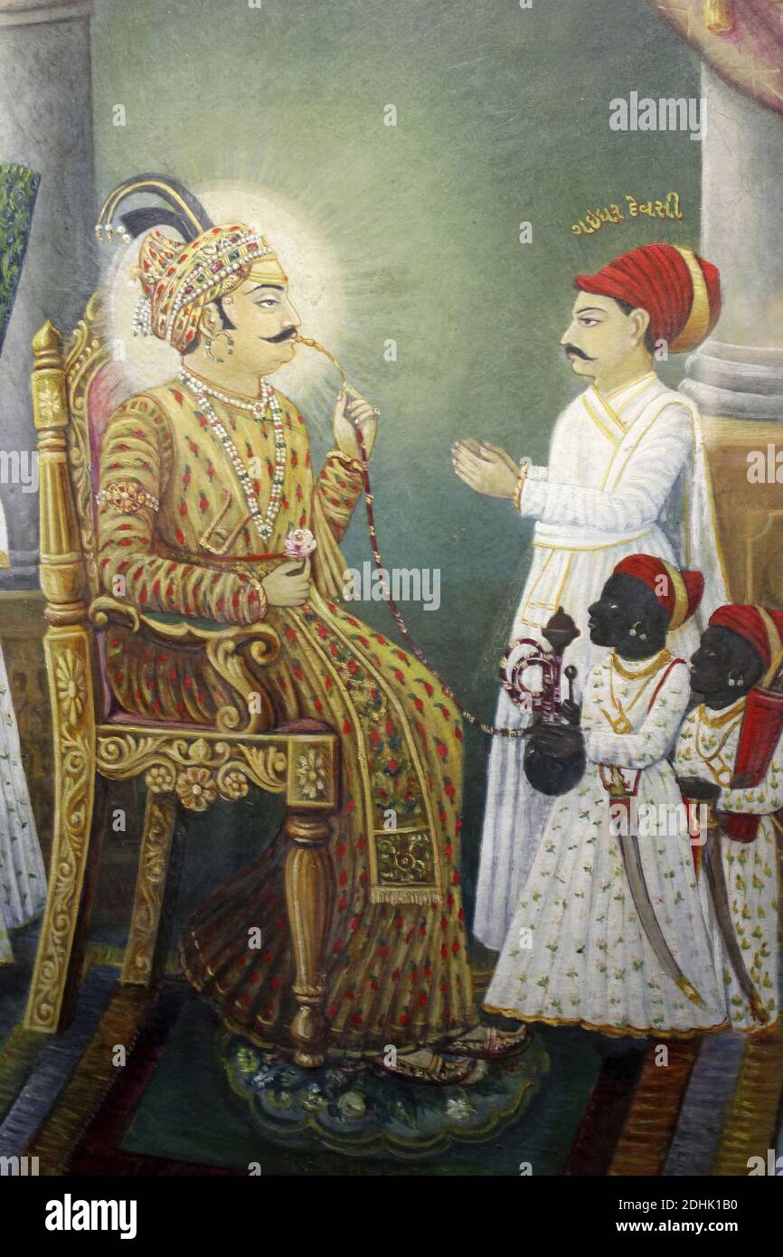 Gujarat Art - Mughal painting showing Maharaja Bhuj smoking hookah pipe with negro servants Stock Photo