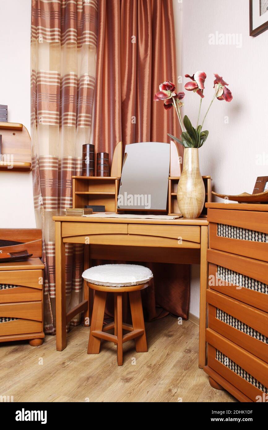 Small room with wooden furniture. Home decor Stock Photo Alamy