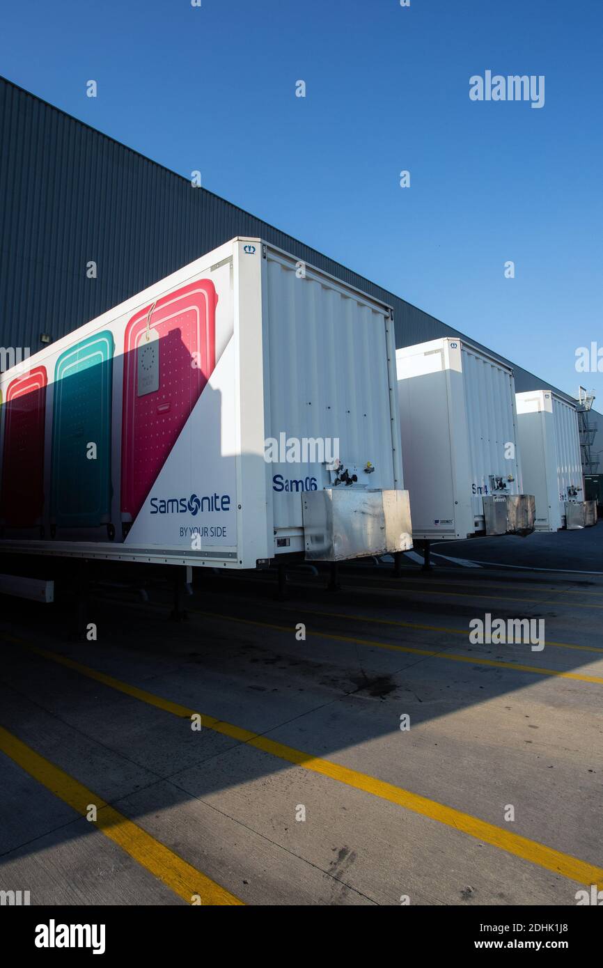 Distribution warehouse with trucks awaiting loading . Stock Photo