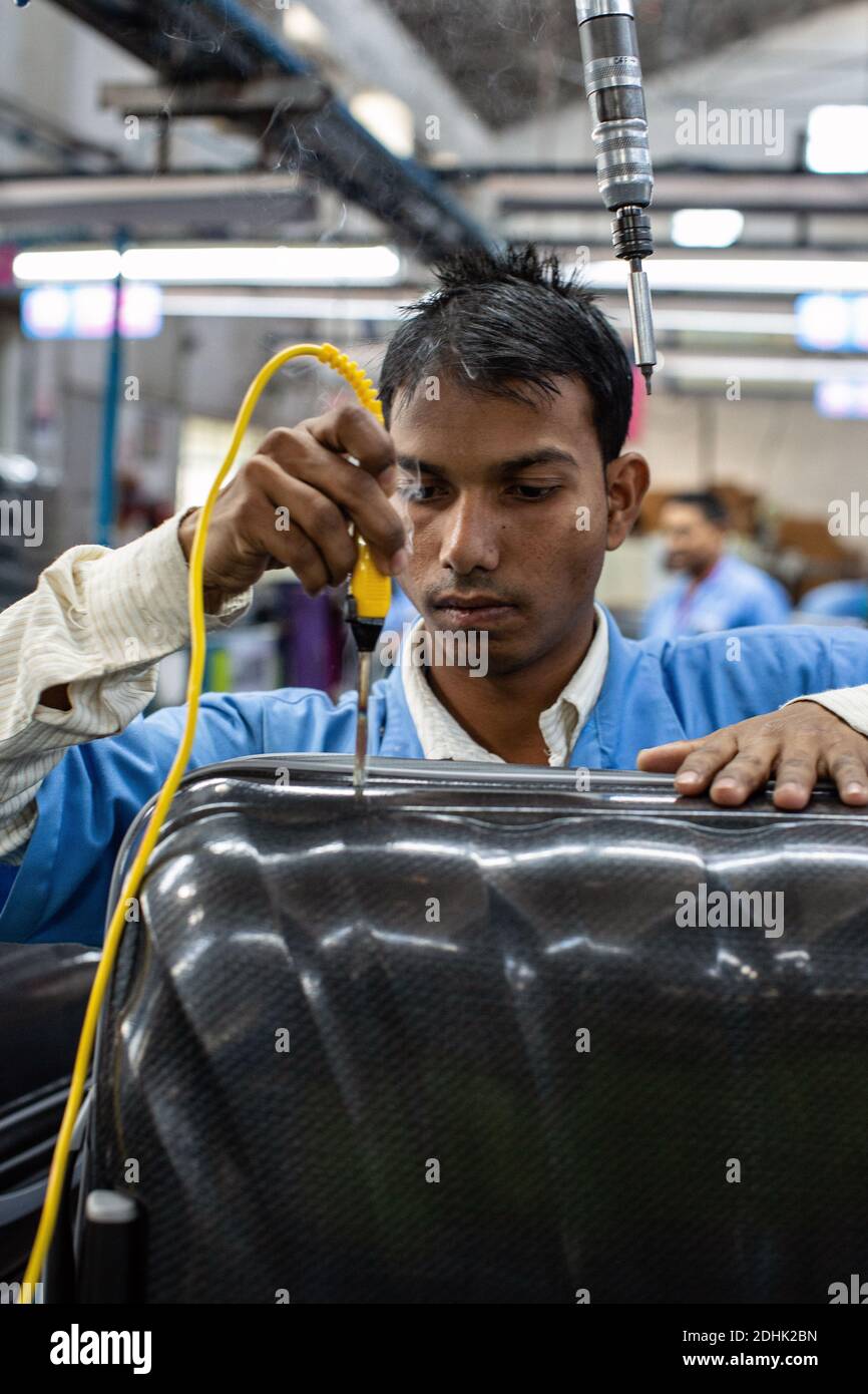 Male workers at Samsonite manufacturing unit in India Stock Photo