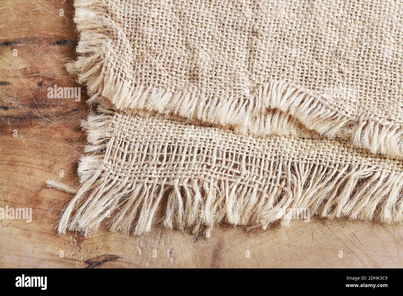 Jute sack on wooden background. Graphic resources Stock Photo - Alamy