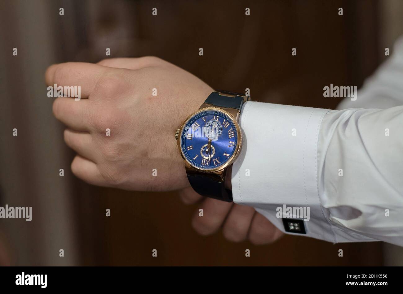 Men's hand watch on the groom's hand, close-up. The preparations of the groom Stock Photo