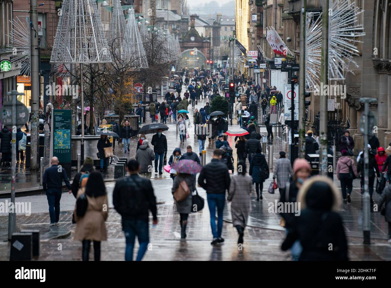 Glasgow, Scotland, UK. 11 December 2021. Covid-19 lockdown level 4 restrictions are lifted in Glasgow. Non essential businesses such as shops and restaurants can reopen from today. Pictured ; Buchanan Street much busier as shops re-opened. Iain Masterton/Alamy Live News Stock Photo