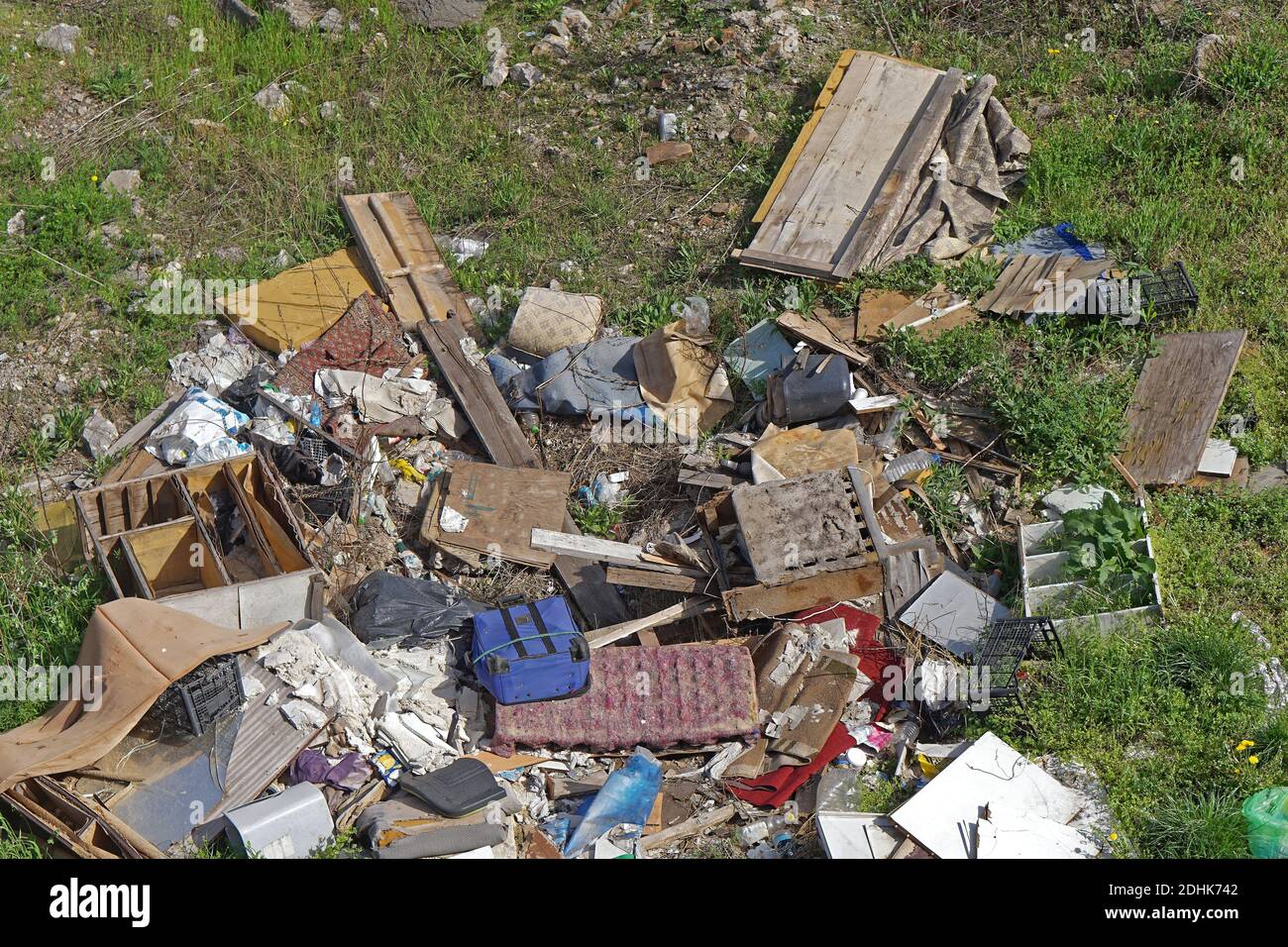 Illegal dumping garbage and trash at field Stock Photo