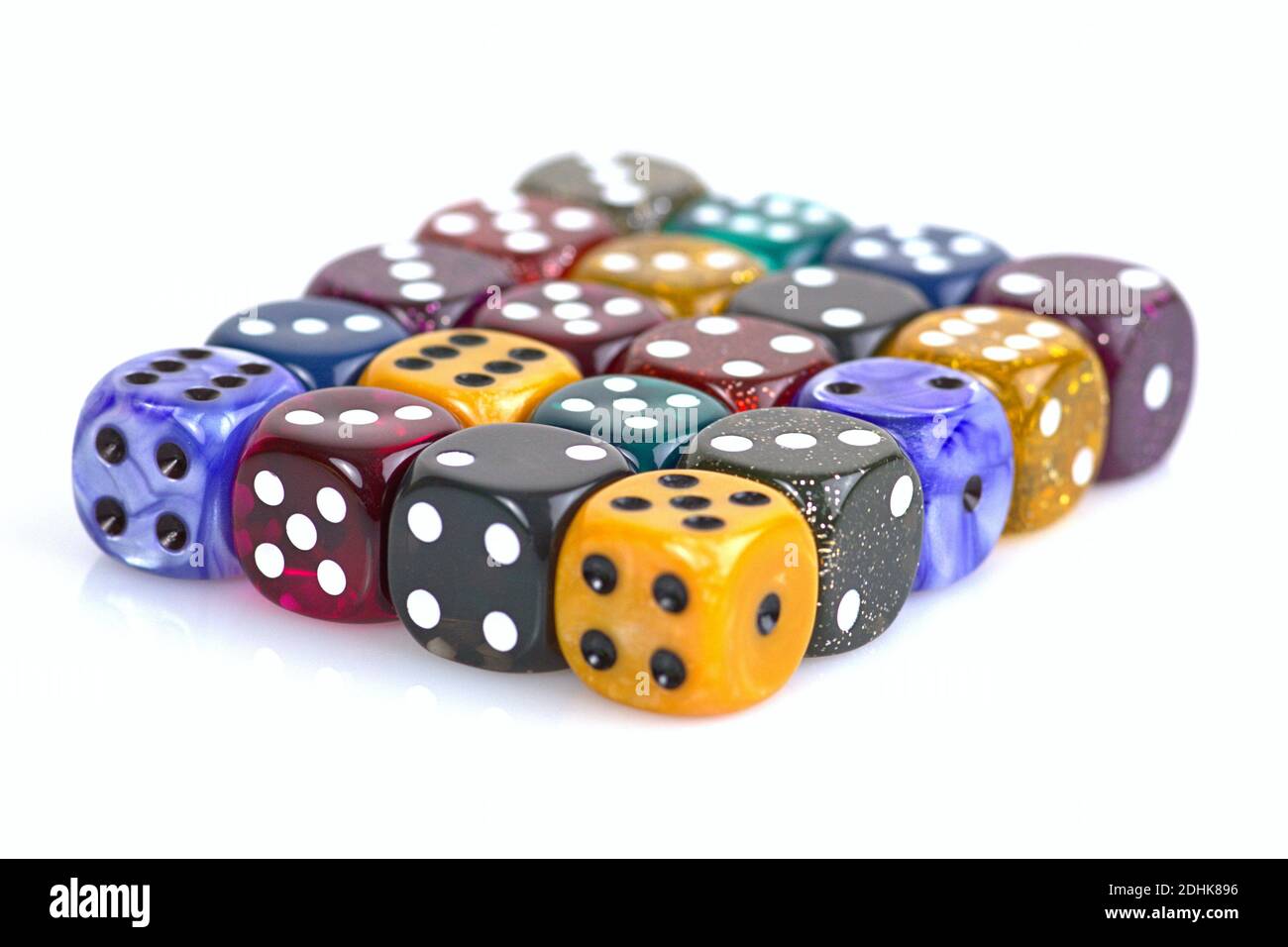 Deutschland. 08th Dec, 2020. The die is cast'. Colorful dice in a row with a slight reflection on the ground in front of a neutral background. | usage worldwide Credit: dpa/Alamy Live News Stock Photo