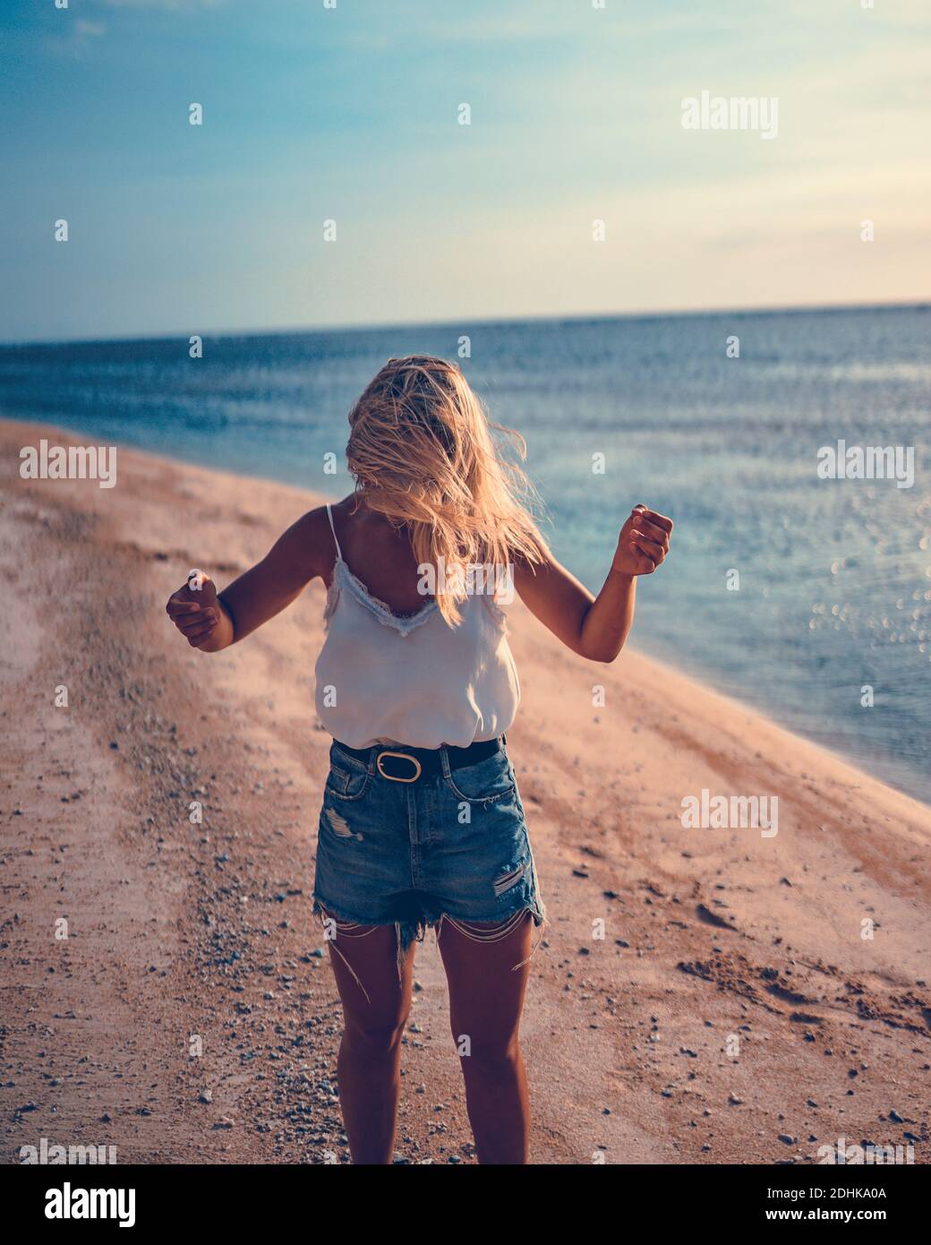 Girl walking on the beach Stock Photo Alamy