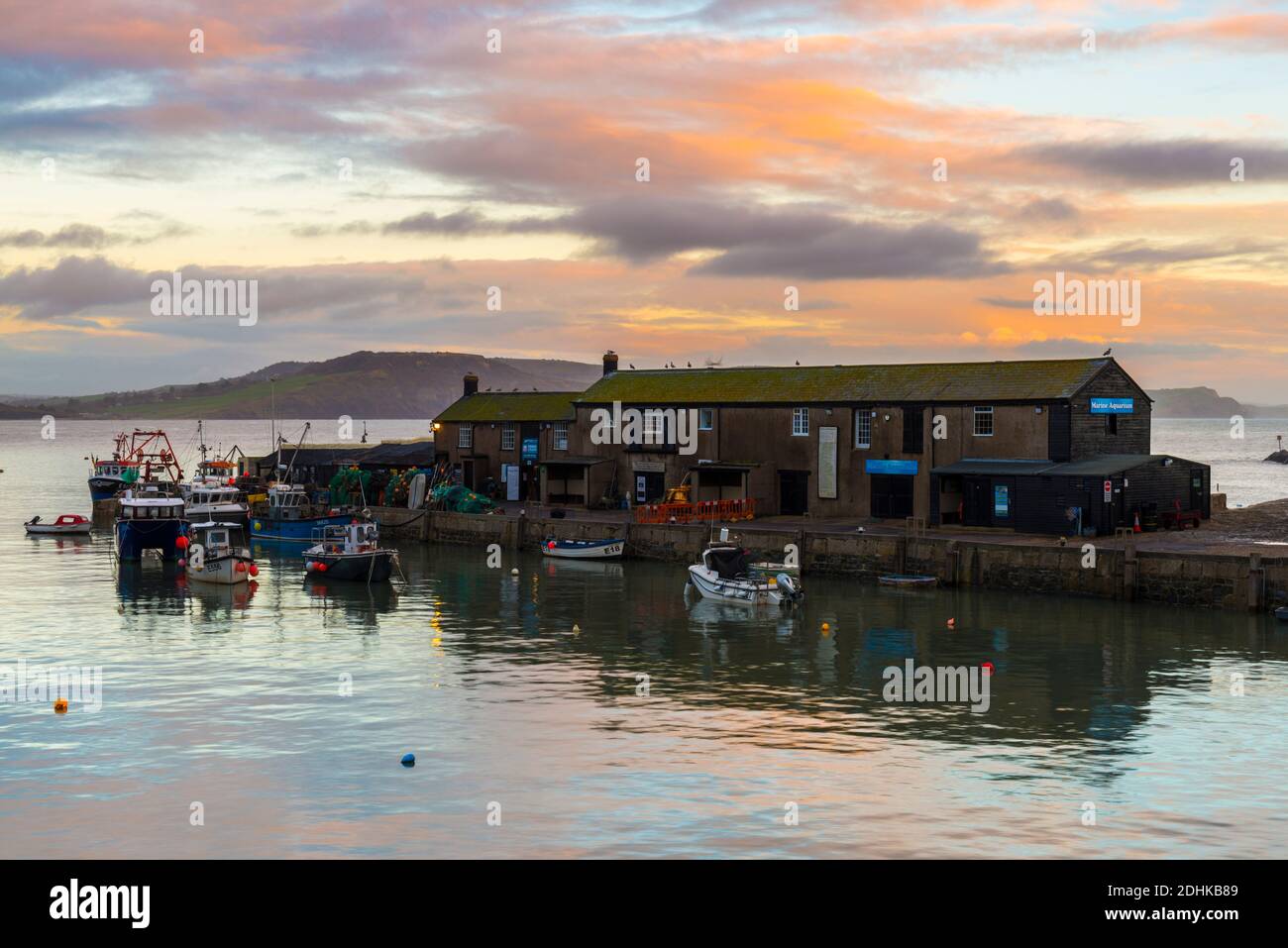 Lyme Regis, Dorset, UK. 11th December 2020. UK Weather. The clouds glow