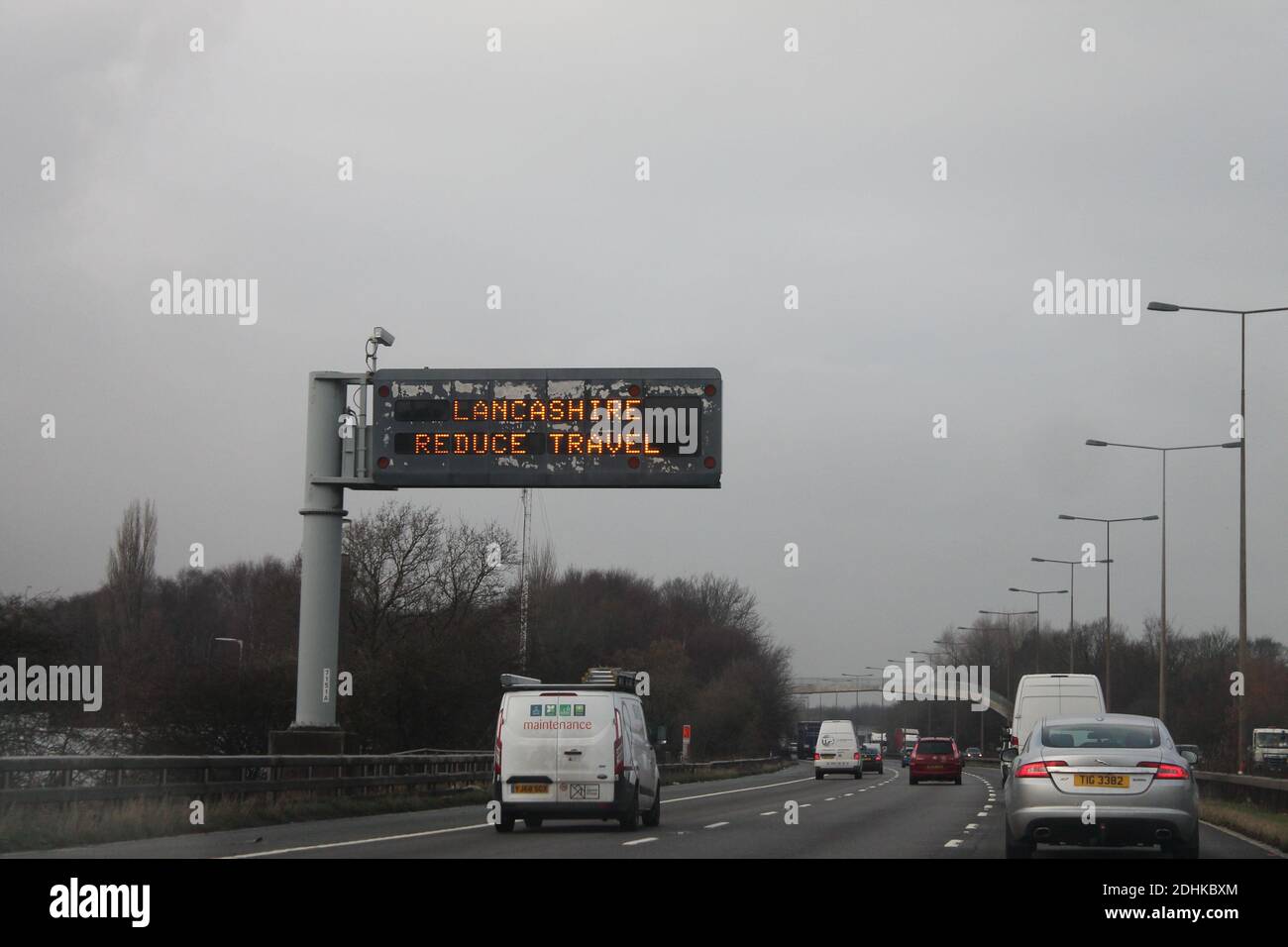 M6 northbound motorway sign Lancashire reduce travel, sign to discourage unnecessary travel during Covid pandemic Stock Photo