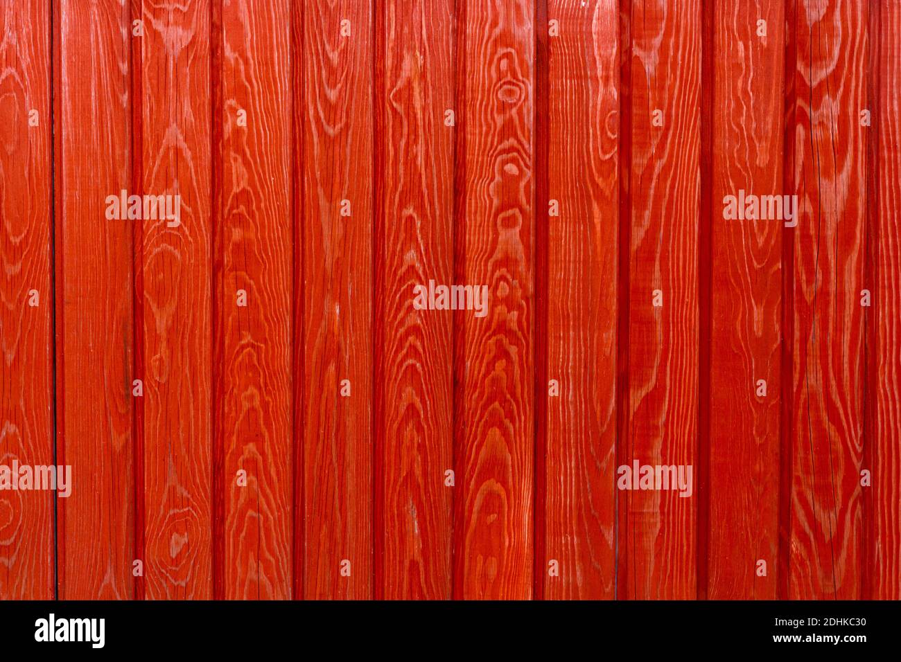 wall made of wooden boards natural wood pine painted in bright red Stock Photo