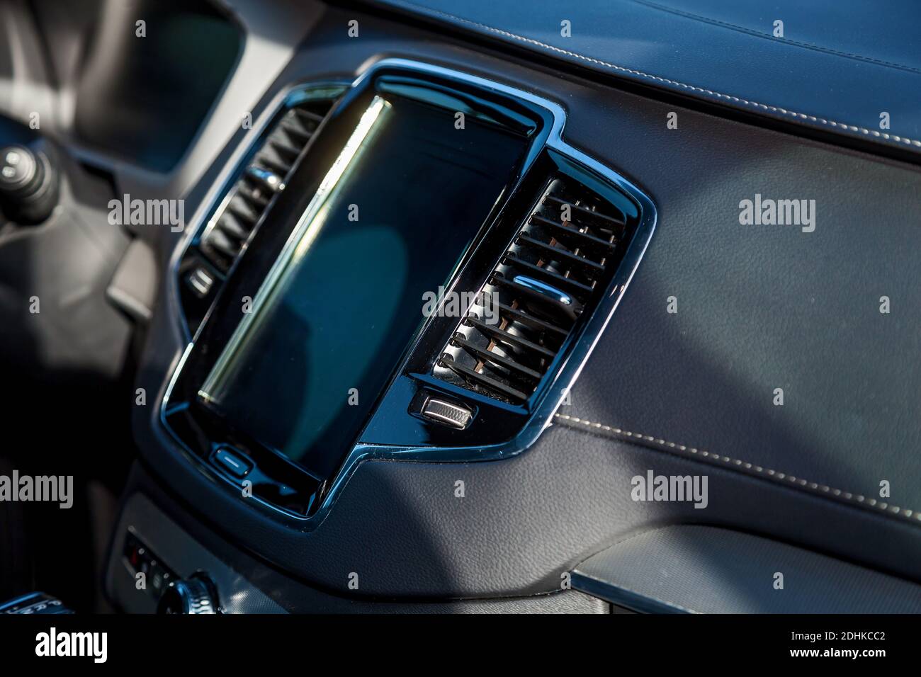 Premium car interior in black leather stitched with white thread Stock