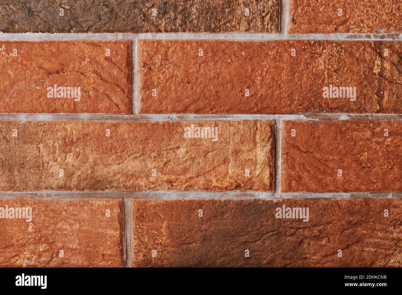 Orange color brick wall background close up view Stock Photo