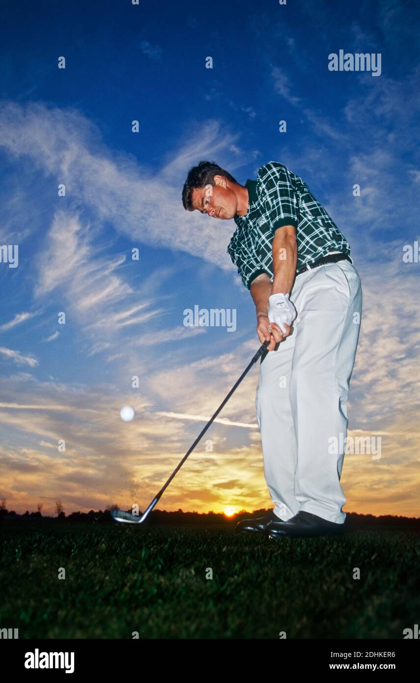 Simon Holmes, international golf coach, playing pitch shot at  Black Bear Golf Club, Florida USA. Stock Photo