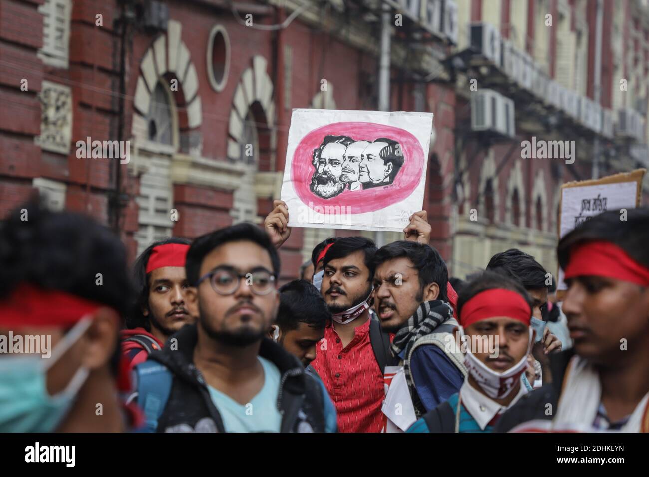 Kolkata, India. 11th Dec, 2020. A protester holding a portrait in the crowd during the demonstration.Activists of AISA (All India Students' Association) staged a protest rally against NRC (National Register of Citizens), CAA (Citizenship Amendment Act) & Farm bill. Credit: SOPA Images Limited/Alamy Live News Stock Photo
