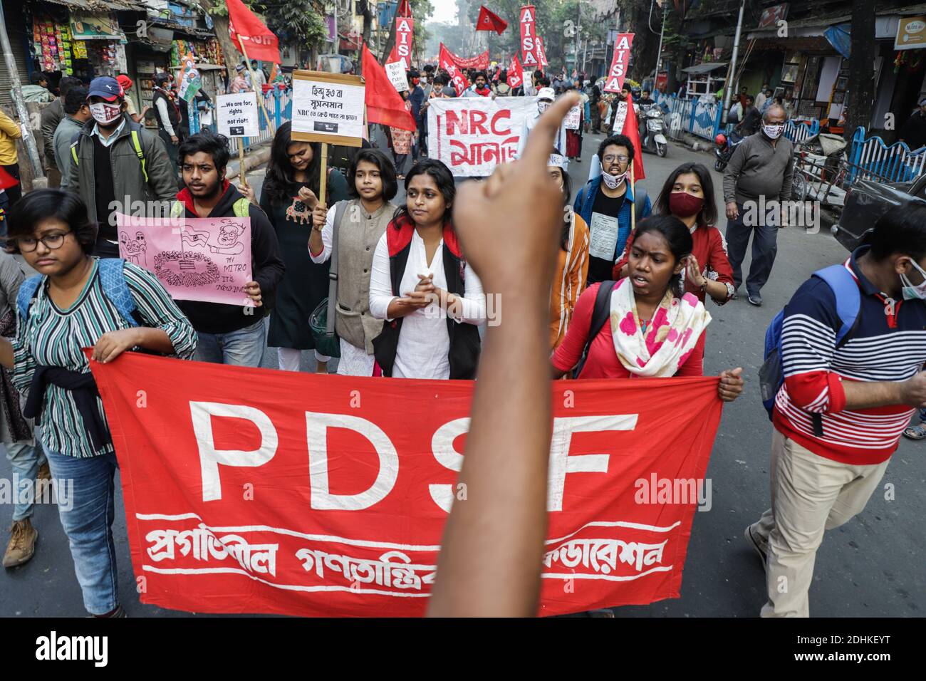 Kolkata, India. 11th Dec, 2020. Protesters marching with a banner expressing their opinion during the demonstration.Activists of AISA (All India Students' Association) staged a protest rally against NRC (National Register of Citizens), CAA (Citizenship Amendment Act) & Farm bill. Credit: SOPA Images Limited/Alamy Live News Stock Photo