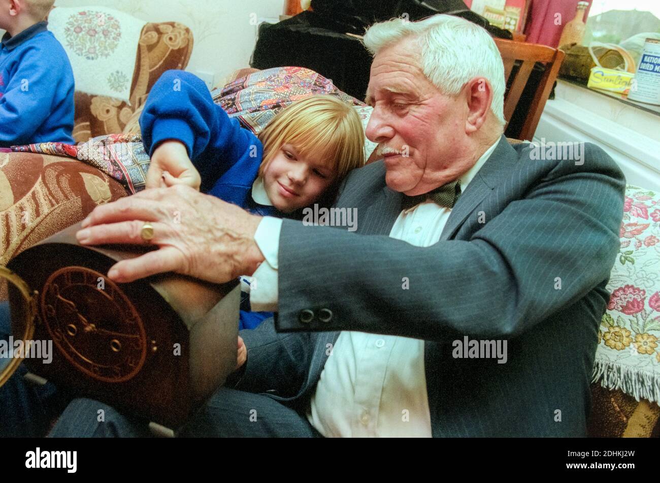 School visit to care home to visit elderly residents and look at memorabilia. UK Stock Photo