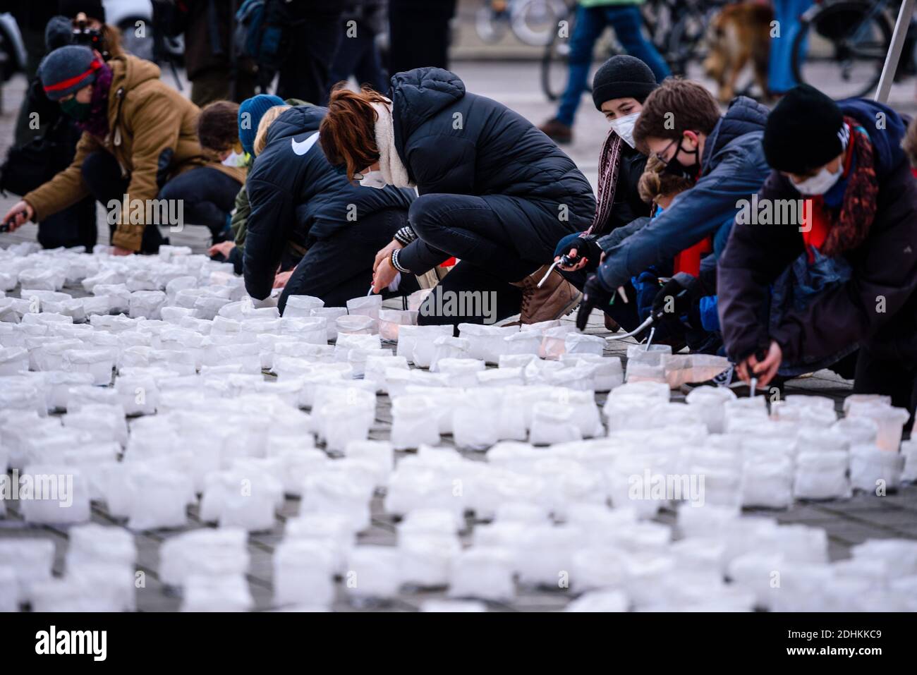 Germany, Berlin, December 11, 2020: Activists light candles as part of an installation, with a lettering '#FightFor1Point5 - fight for 1.5 degrees!' made of thousands of candles, the organizers around the climate movement Fridays for Future want to draw the attention of the German government to the compliance with this goal on the occasion of the fifth anniversary of the Paris Climate Agreement on December 12. In order to still reach the 1.5 degree target of the Paris climate agreement, a reduction of CO2 emissions by at least 60 percent is necessary. (Photo by Jan Scheunert/Sipa USA) Stock Photo