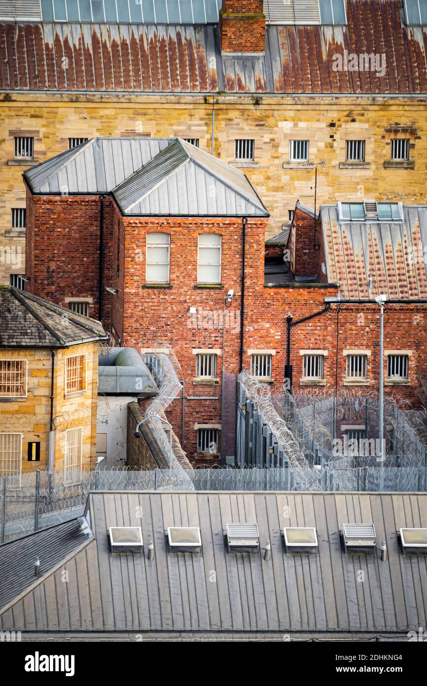 The buildings and barbed wire enclosures of HM Prison Durham, in the city centre Stock Photo