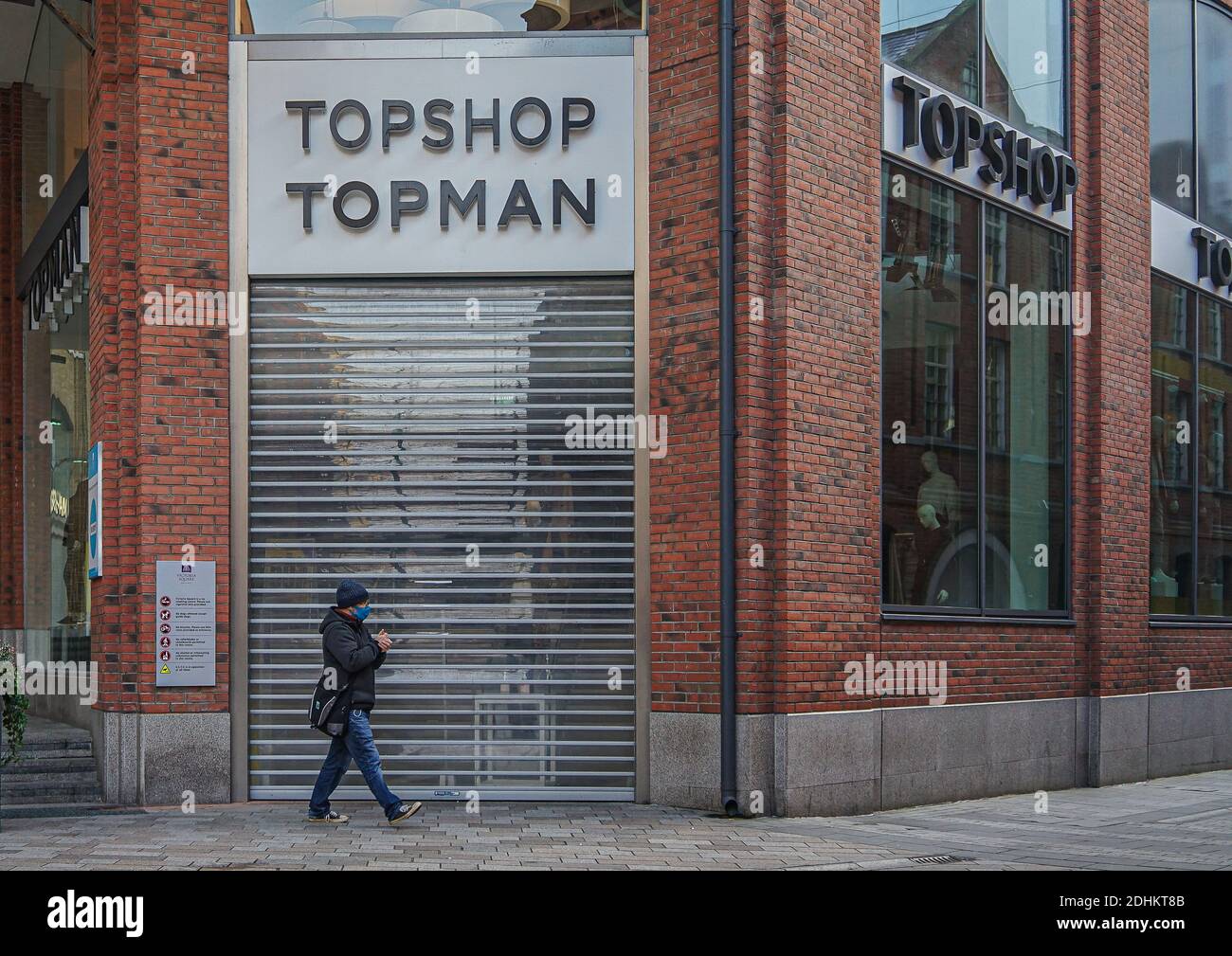 Belfast, Antrim, UK. 6th Dec, 2020. A shopper wearing a face mask as a  precaution against the spread of covid-19 passing by the Topshop/Topman  Store. Credit: Michael Mcnerney/SOPA Images/ZUMA Wire/Alamy Live News