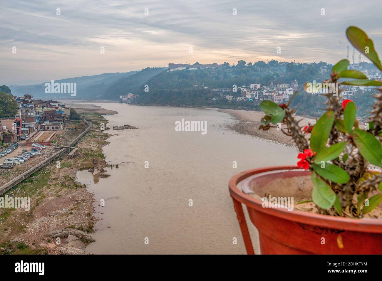 Jammu city and hill on which Bahu Fort Park  in right upper corner . Morning. Stock Photo