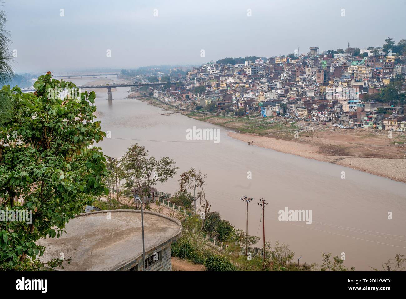 Aerial cityscape of Jammu from Bag-i-Bahu park. Traffic on bridge in left corner . River Tawi Stock Photo