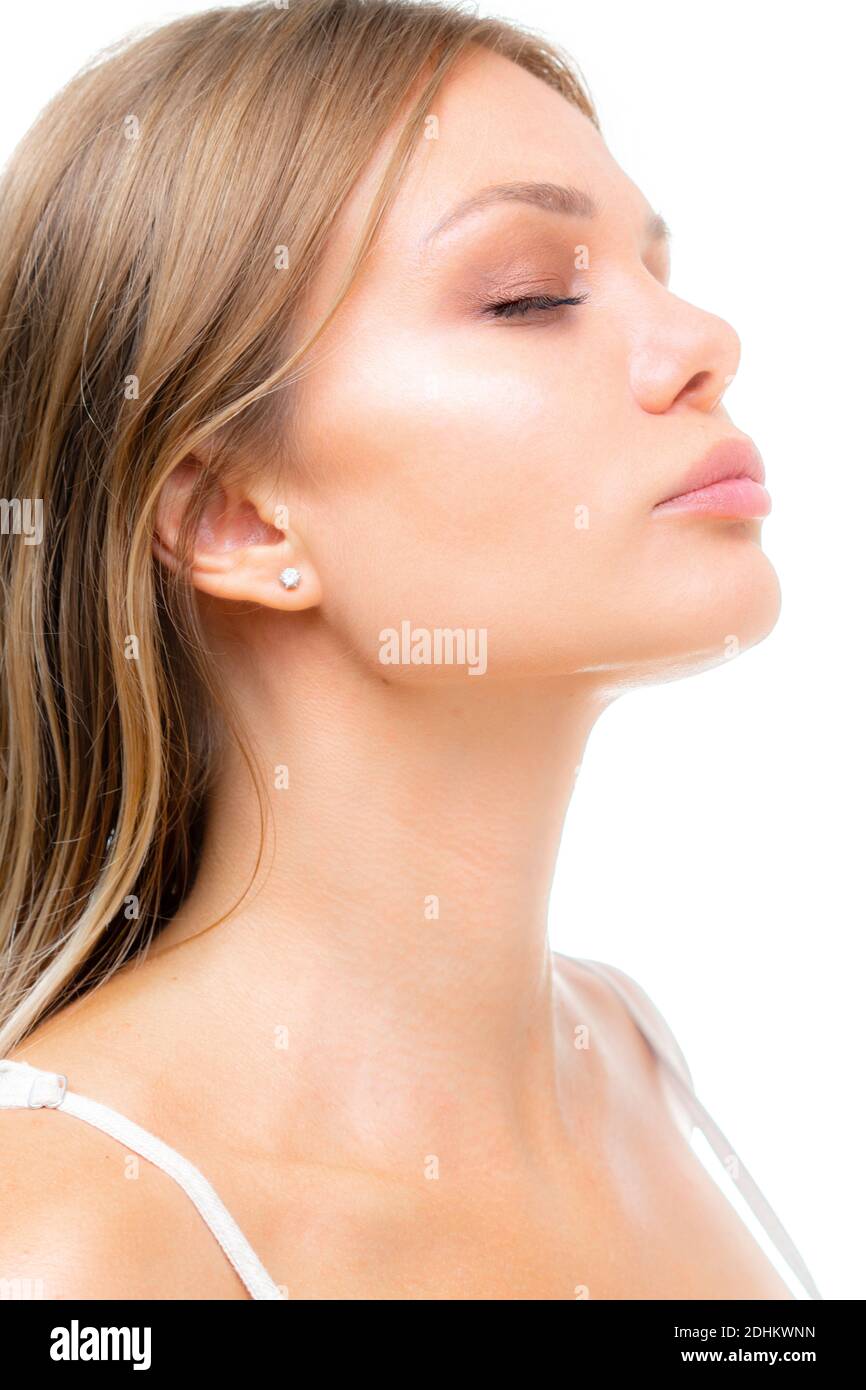 A portrait of a beautiful young woman's profile with her eyes closed