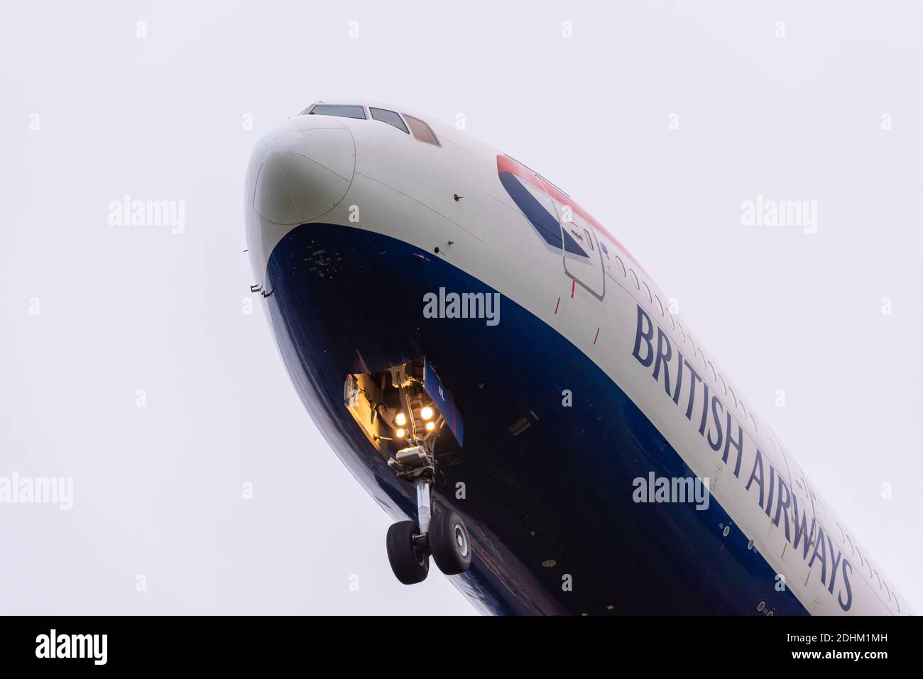 Early morning arrival. jet airliner plane on approach to land at London Heathrow Airport, UK, during COVID 19 pandemic. British Airways. Undercarriage Stock Photo
