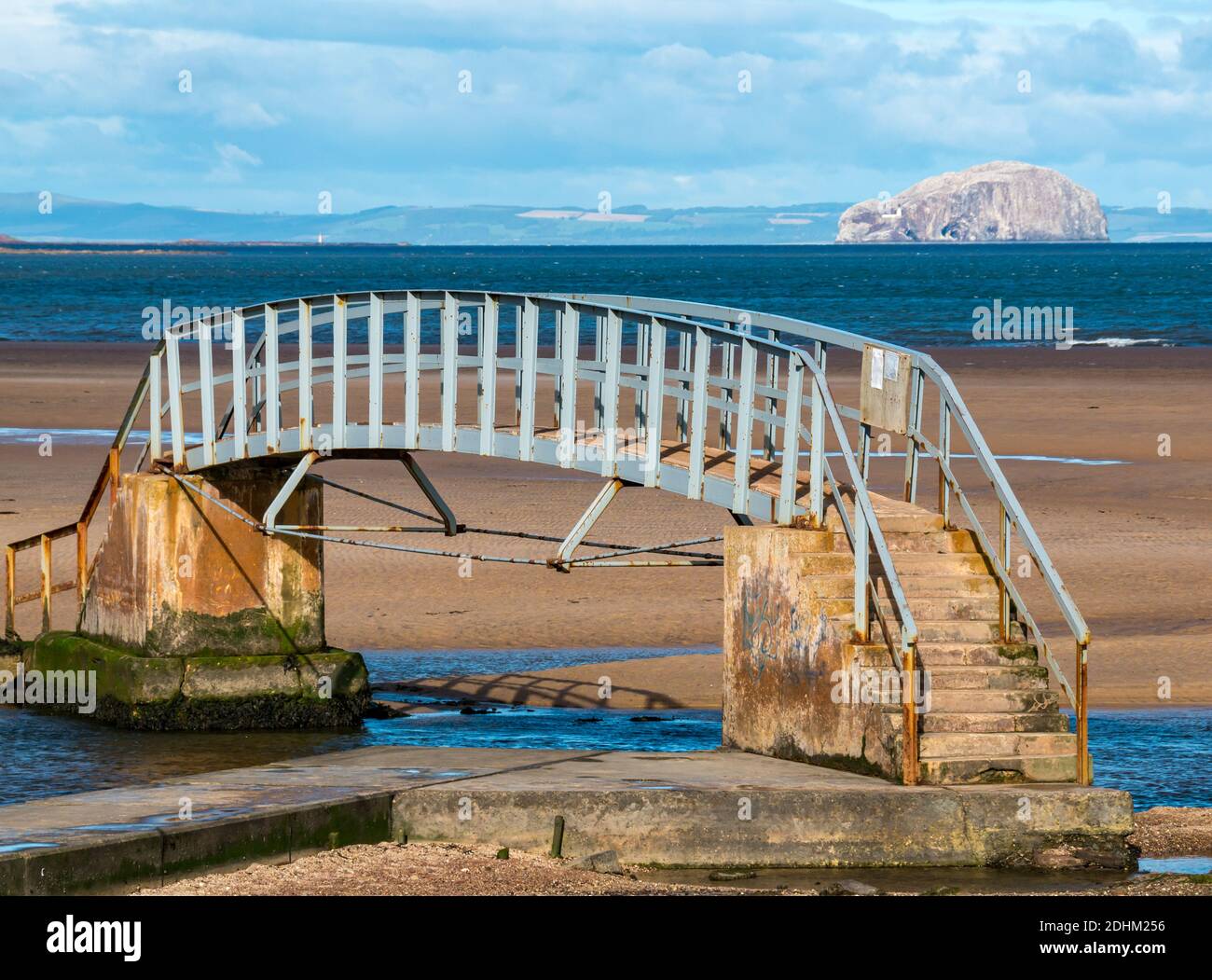 Bridge to Nowhere, Belhaven Bay on sunny day at low tide with Bass Rock in Firth of Firth on the horizon, East Lothian, Scotland, UK Stock Photo