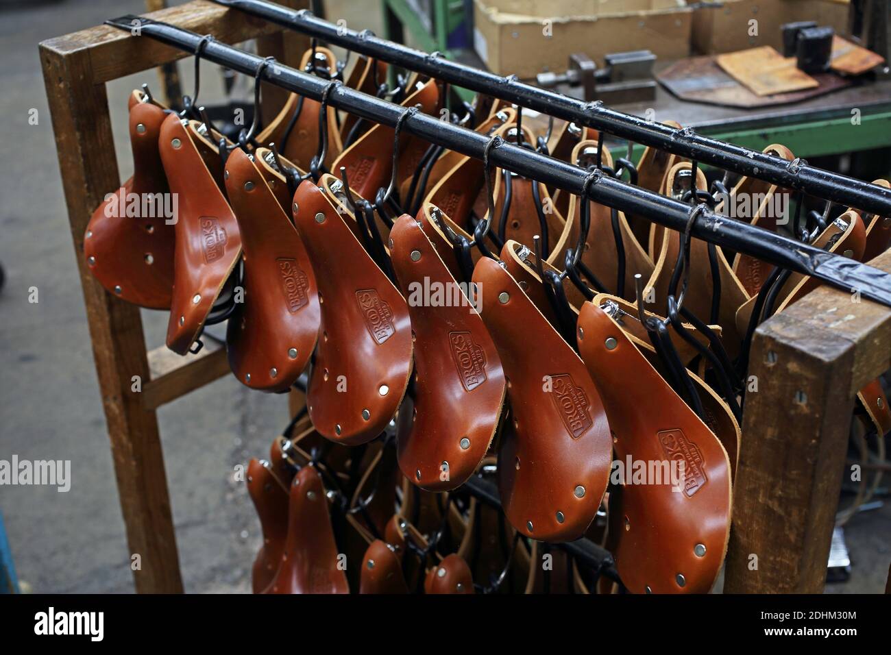 United Kingdom / Birmingham/  Smethwick/ Brooks England/ Rack of saddles at the Brooks saddle factory in Birmingham, UK. Stock Photo