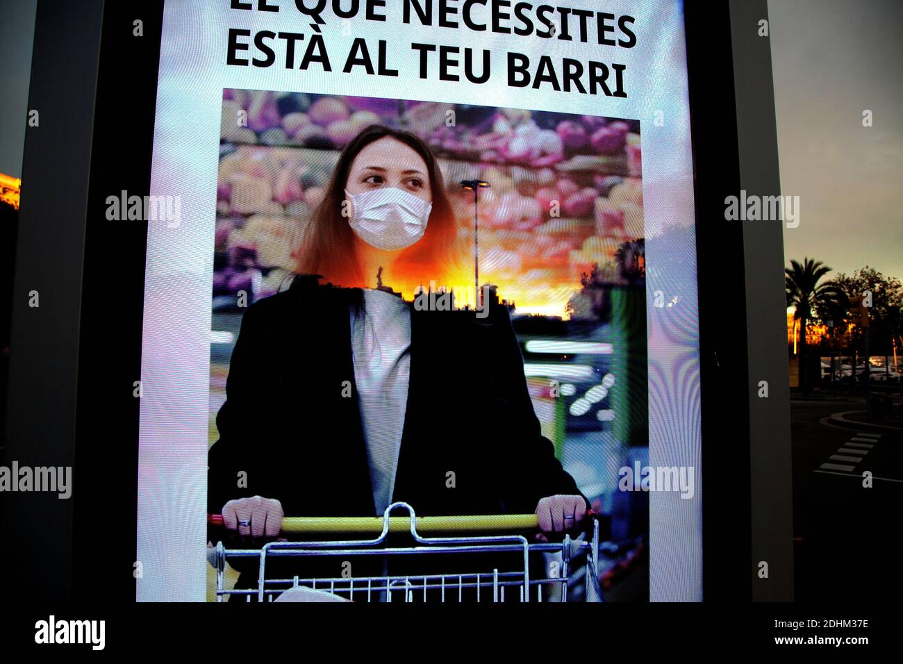 Digital advert asking people not to leave their neighbourhood, Barcelona, Spain. Stock Photo