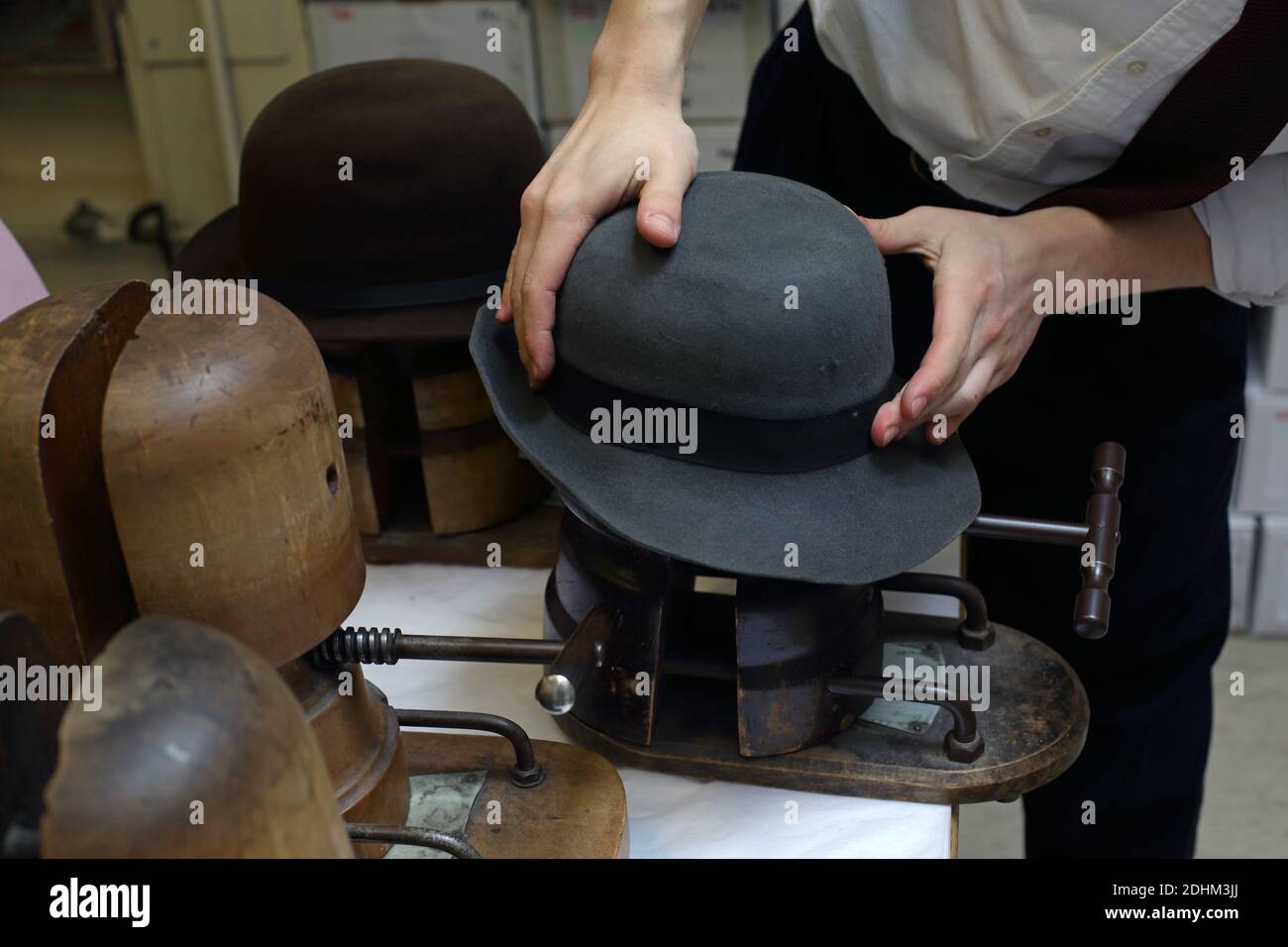 Lock & Co Hatters , Makers of hats, The hatstrecher Steaming the hat,in order to recover its original shape. Stock Photo
