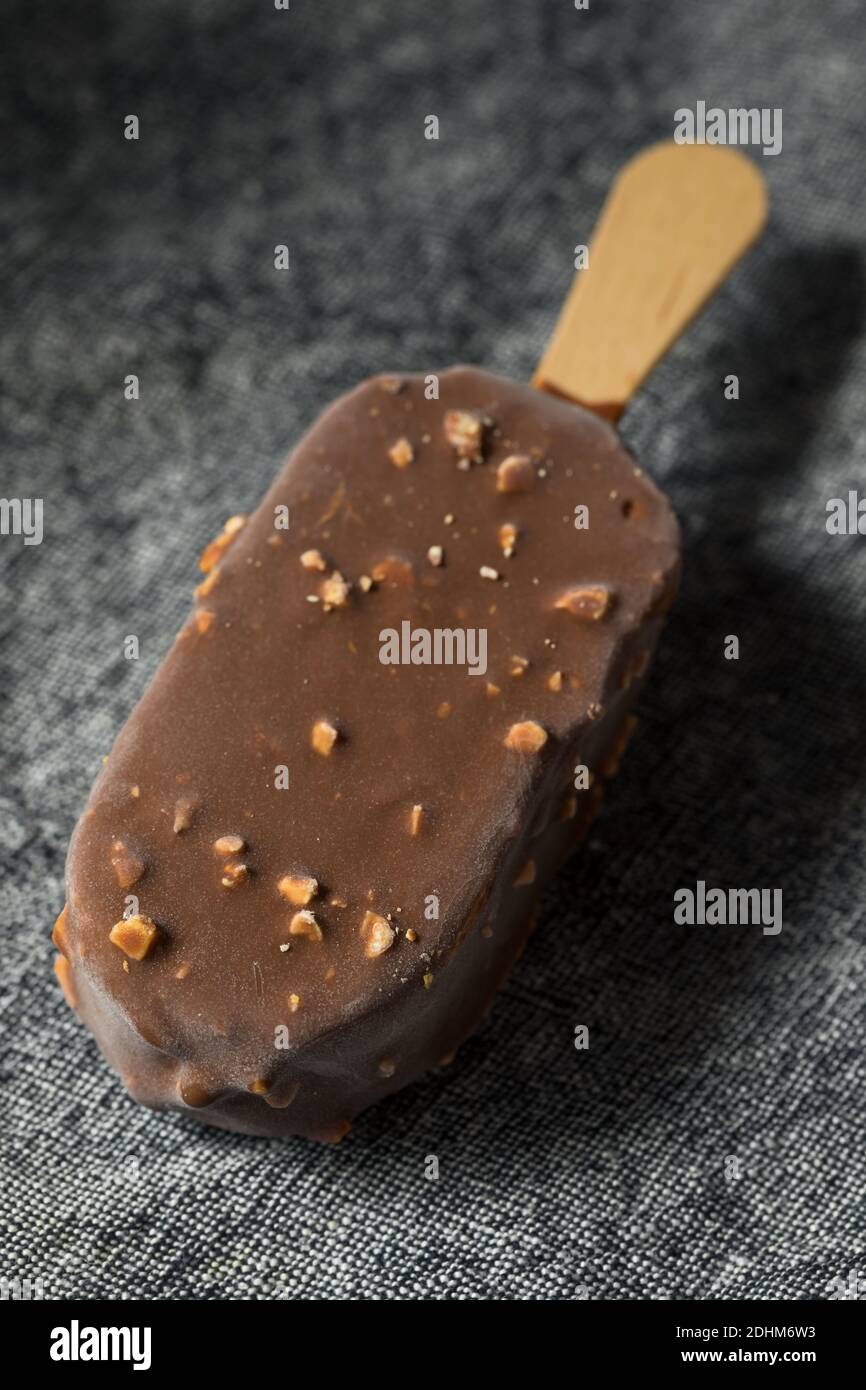 Frozen Chocolate Covered Ice Cream Bars with Nuts Stock Photo