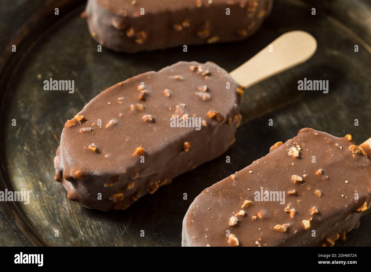 Frozen Chocolate Covered Ice Cream Bars with Nuts Stock Photo