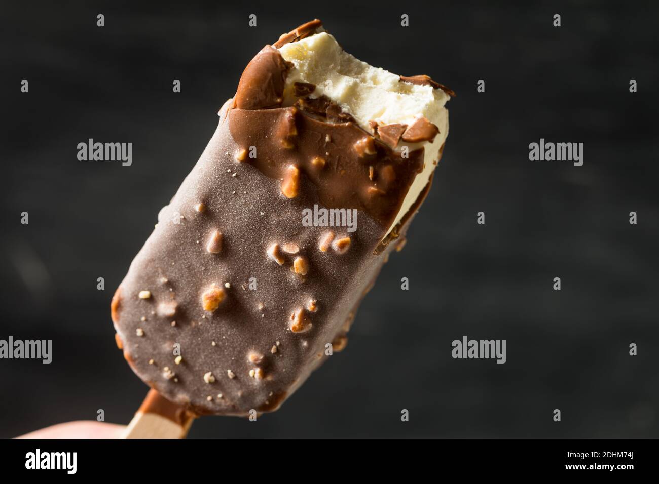 Frozen Chocolate Covered Ice Cream Bars with Nuts Stock Photo