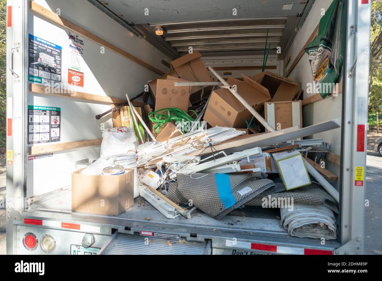 UHaul moving truck loaded with boxes and household waste and debris