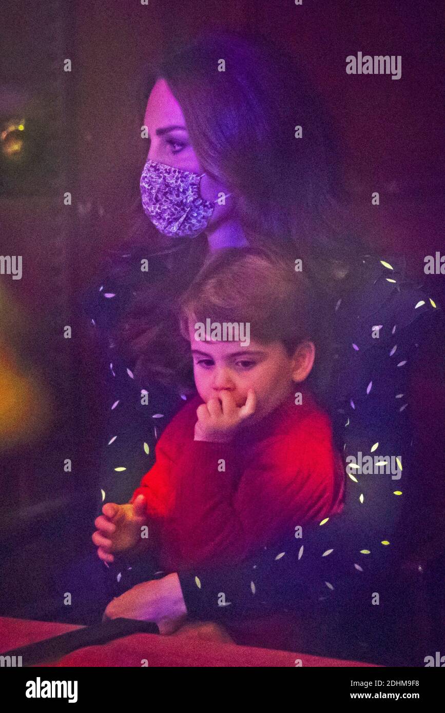 Britain's Catherine, Duchess of Cambridge with Prince Louis attend a  special pantomime performance hosted by The National Lottery, to thank key  workers and their families for their efforts throughout the COVID-19  pandemic