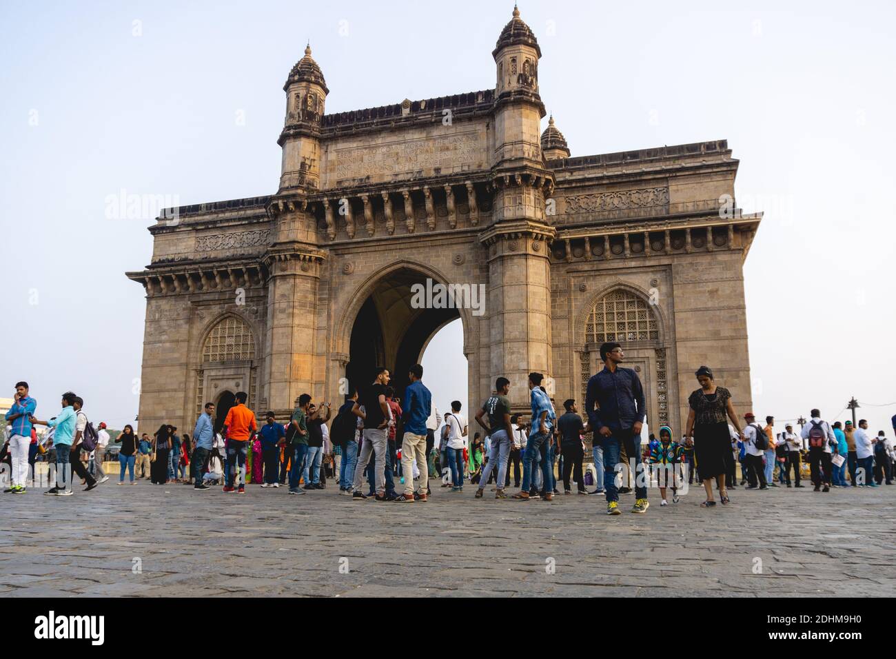 Gateway of India, a famous building at the port of Mumbai, India. people flocking in front of the monument in the weekend for a visit. Stock Photo