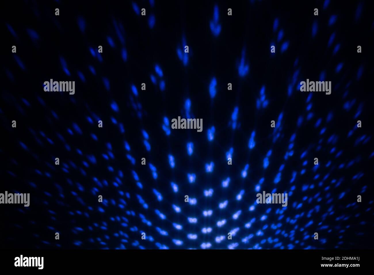 Blue Lighting effect on dark wall, defocused decorative abstract background. Stock Photo