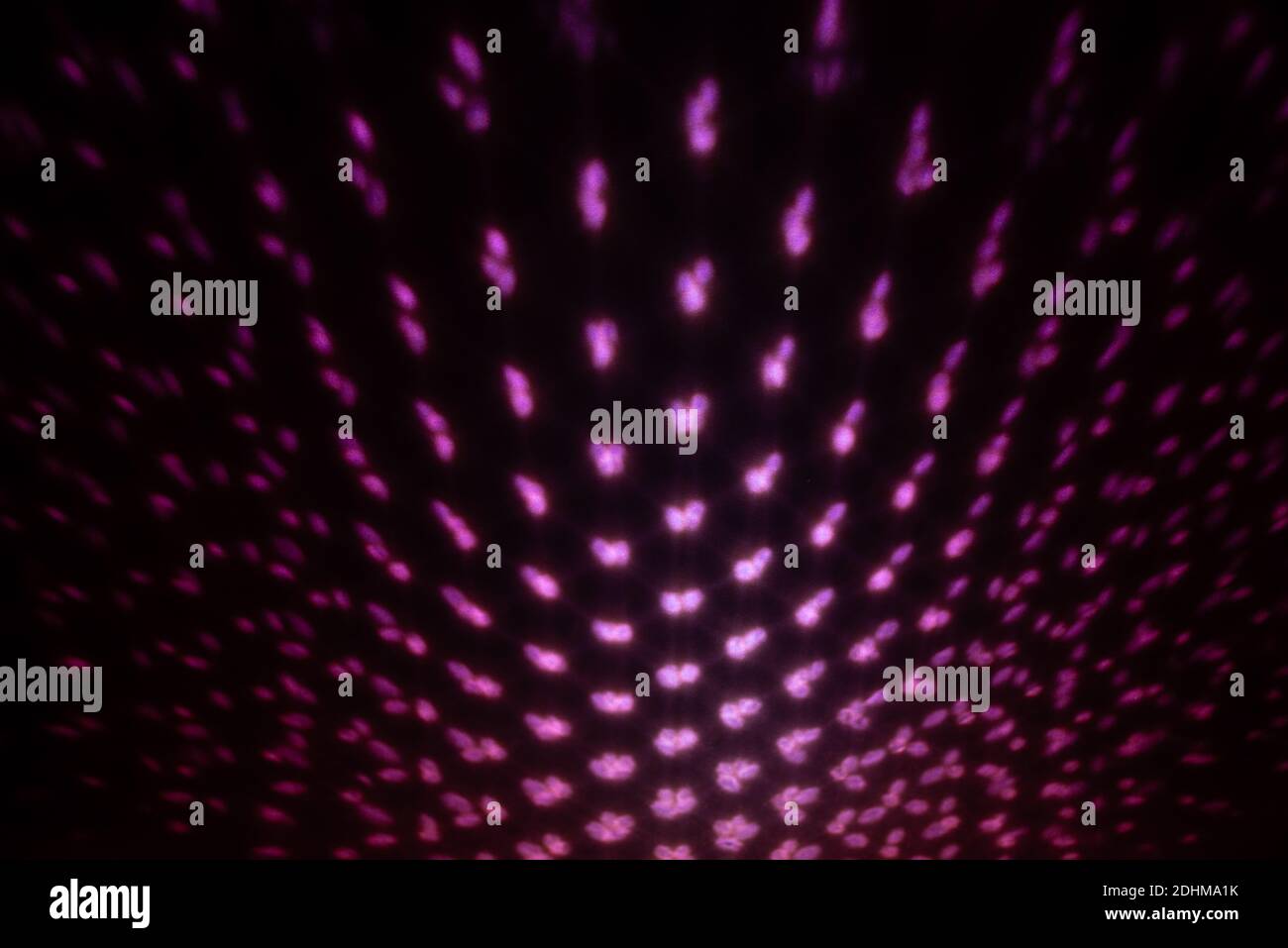 Red Lighting effect on dark wall, defocused decorative abstract background. Stock Photo