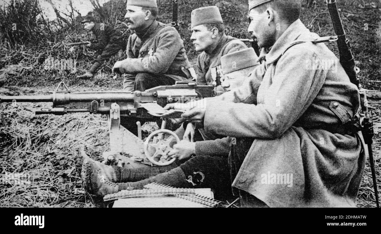 A historical photograph of Algerian tirailleurs maning a St. Étienne Mle 1907 machine gun, prepared for a German attack at Carency, Pas-de-Calais, France, taken from a postcard c.1914-1916. Stock Photo