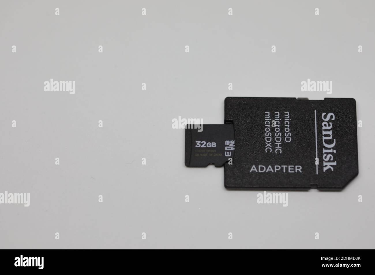 A micro SD  card  and its adapter showing their upper sides Stock Photo